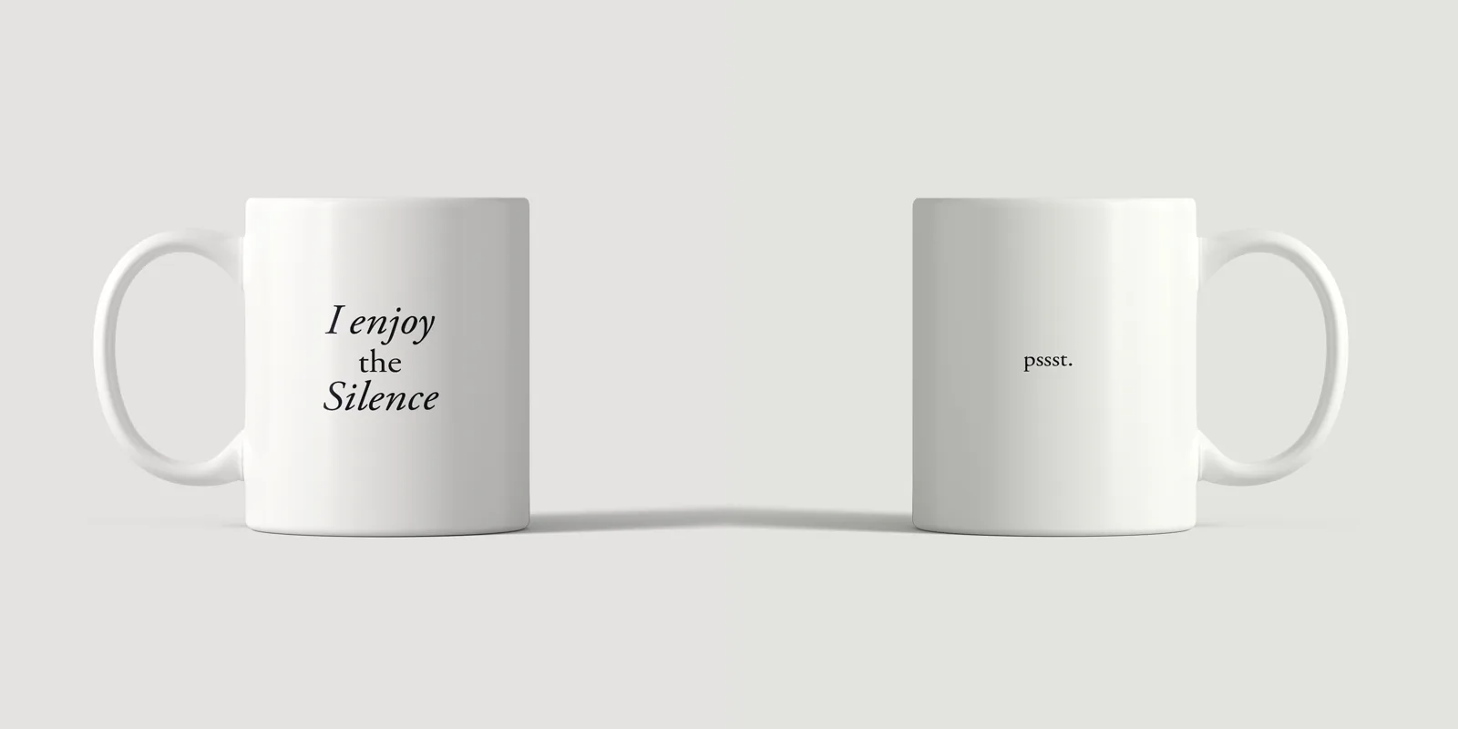 Front of the I Enjoy The Silence mug and back reading pssst., side by side